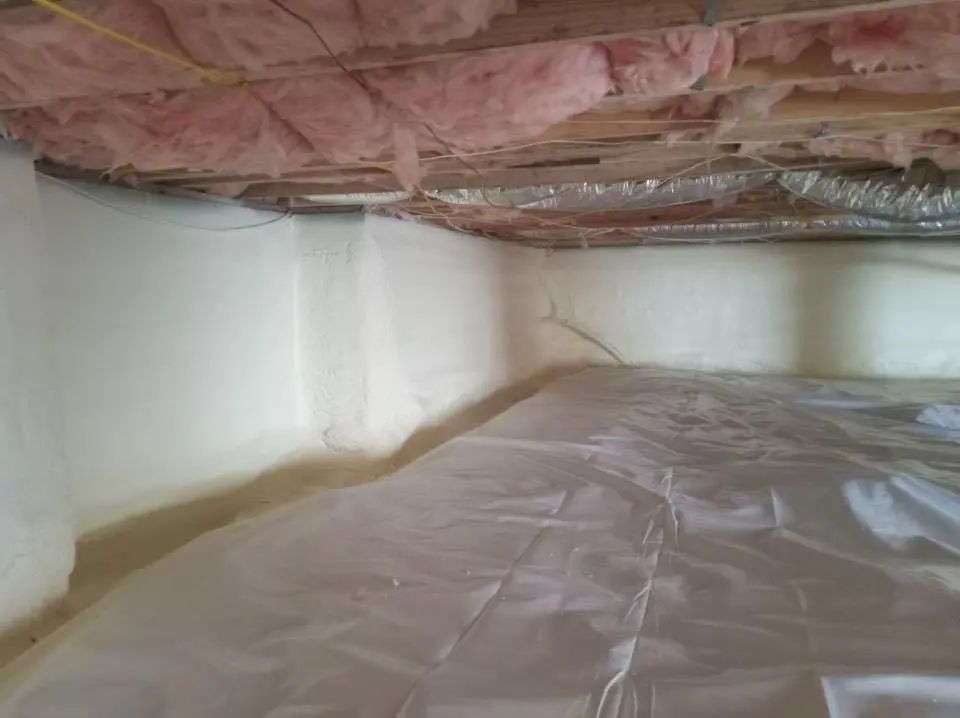 Crawl space encapsulation with closed-cell spray foam for Commercial Roof Restoration in Wilmington